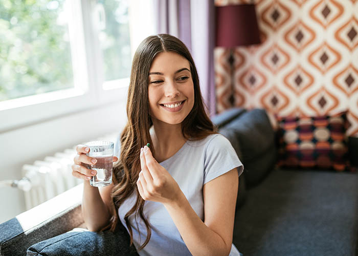Woman taking supplements