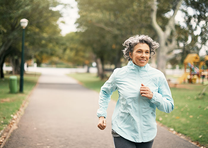Middle age woman on a neighborhood jog.