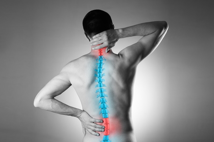 Pain in the spine, a man with backache, back and neck