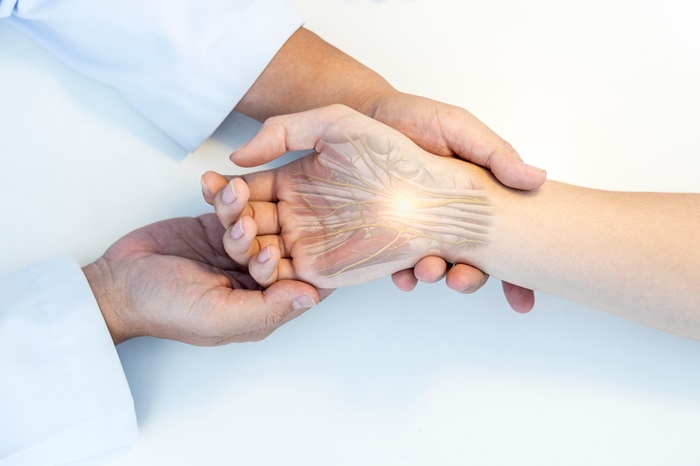 The orthopedic doctor or surgeon in uniform examined the patient
