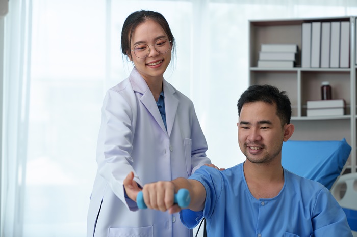The doctor counsels the patient about pain in the muscles of the arms and elbows. office syndrome problem physical therapy diagnostic concept