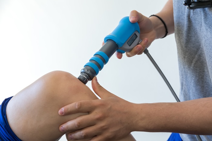 Shockwave therapy on an injured knee