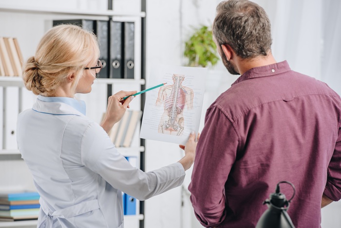 Chiropractor explaining treatment plans