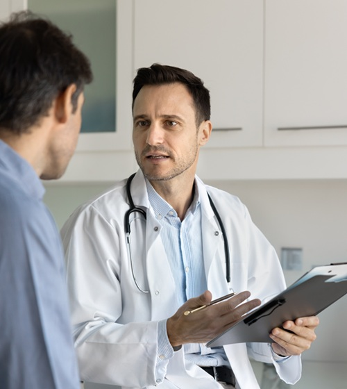Doctor evaluating a patient for lumbar spinal stenosis