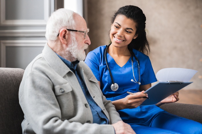 Pain management physician consulting with patient about hip condition