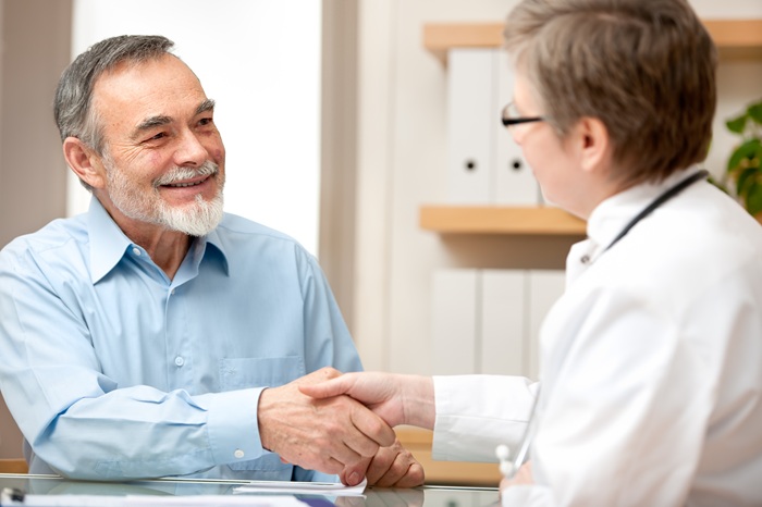 Doctor and patient shaking hands
