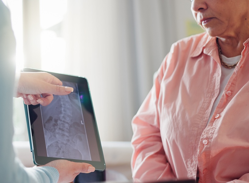Patient consulting surgeon about hip replacement