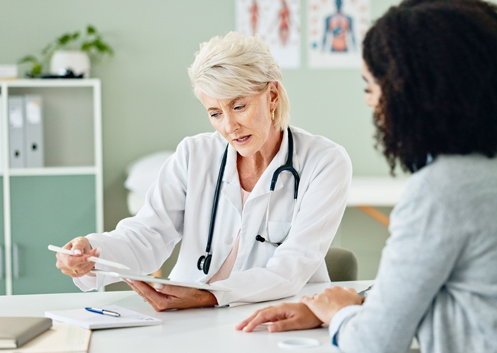 Doctor and patient hip surgery consultation