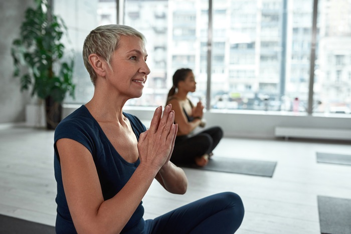 Woman doing therapeutic yoga