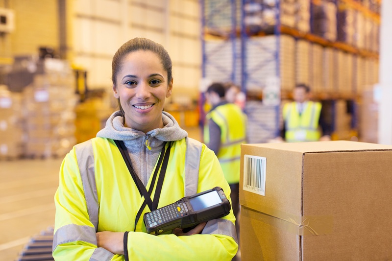 Smiling female warehouse worker