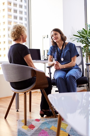 Doctor consulting with her patient about hip pain treatment options