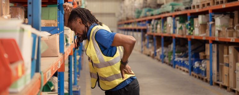 Warehouse worker with chronic lower back pain