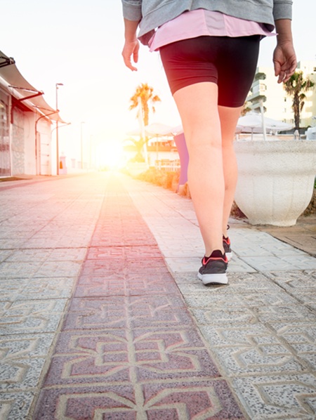 Woman walking to rehab an injured foot