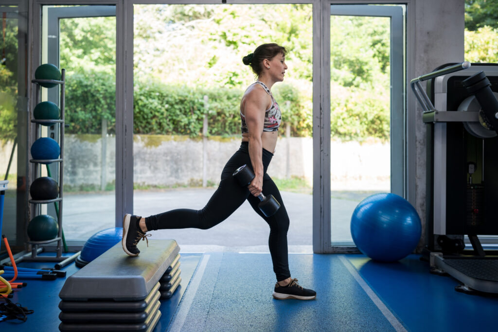 Woman doing weighted lunges